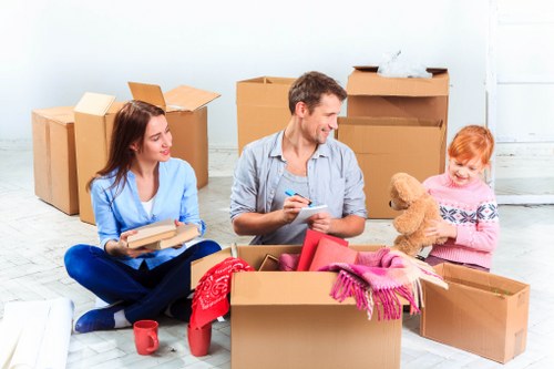 Careful handling of household furniture during a Woolwich relocation