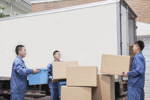 Packed office equipment and furniture ready for relocation in Woolwich