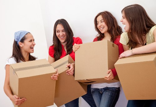 Removal team preparing a move in Woolwich with boxes and furniture