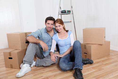 Household boxes and furniture arranged for a Woolwich removals van move