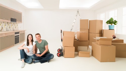 Professional movers handling a household relocation in Woolwich
